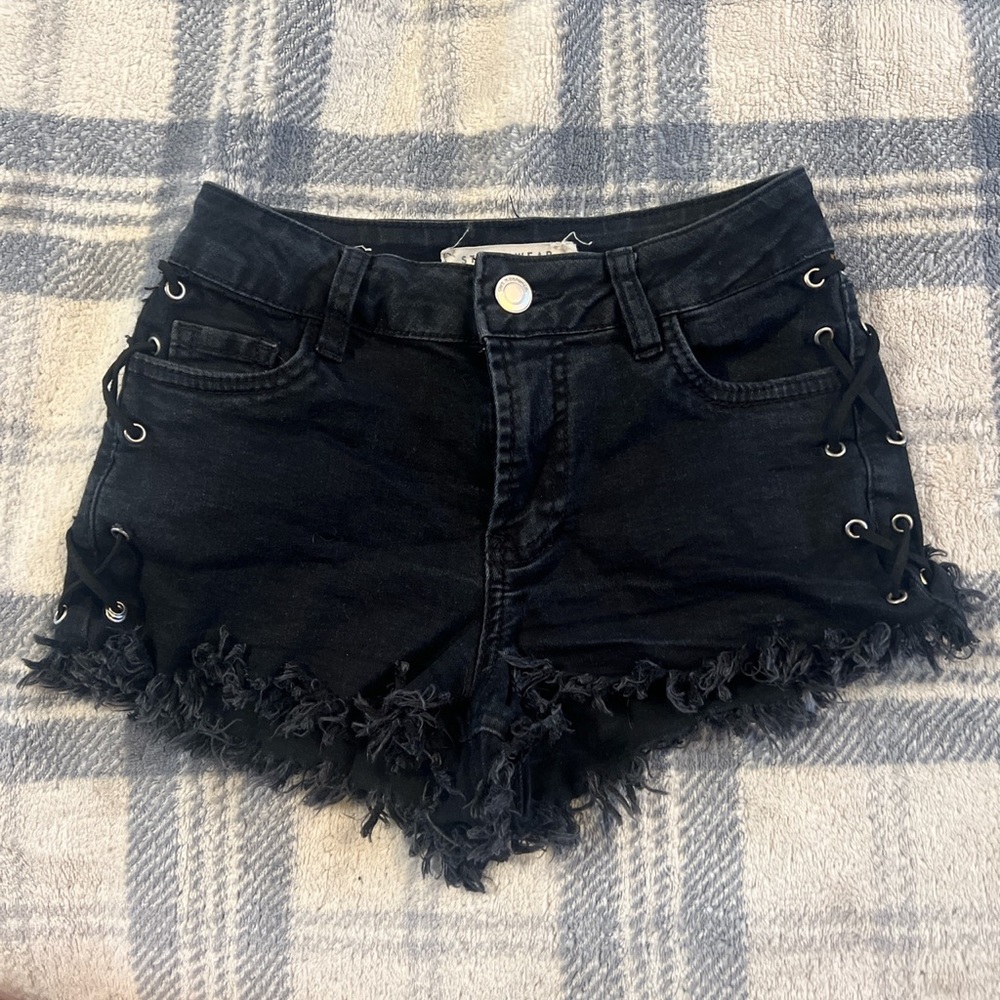 Black lace up fringe shorts